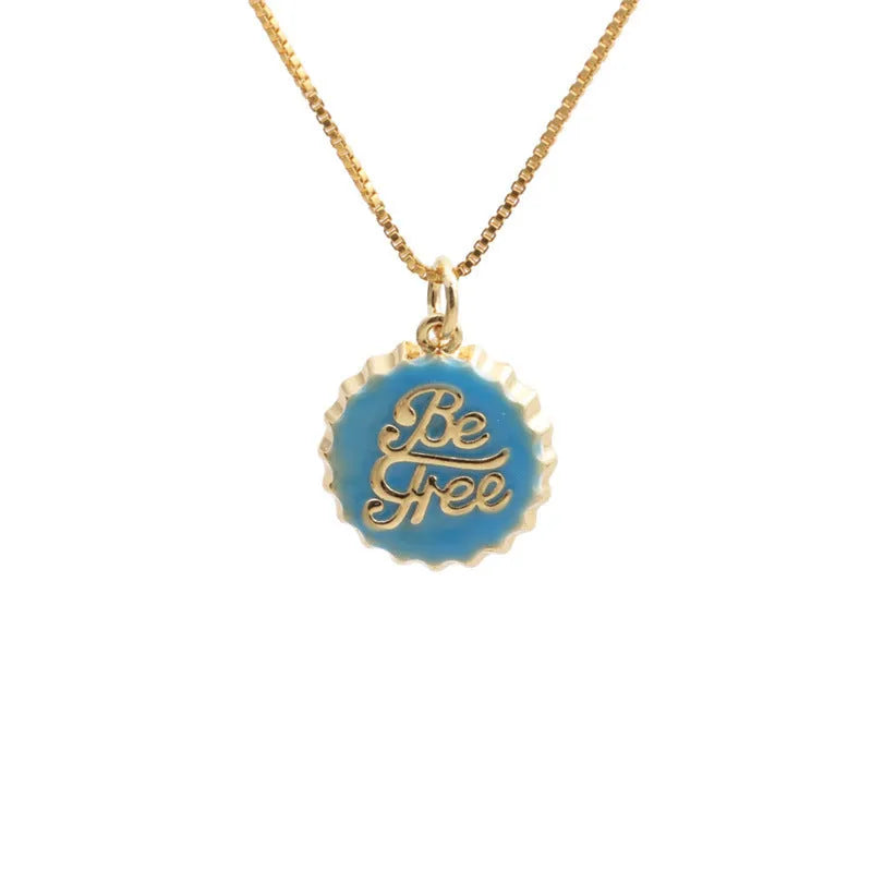 Copper bottle cap pendant necklace with gold plating on a box chain.