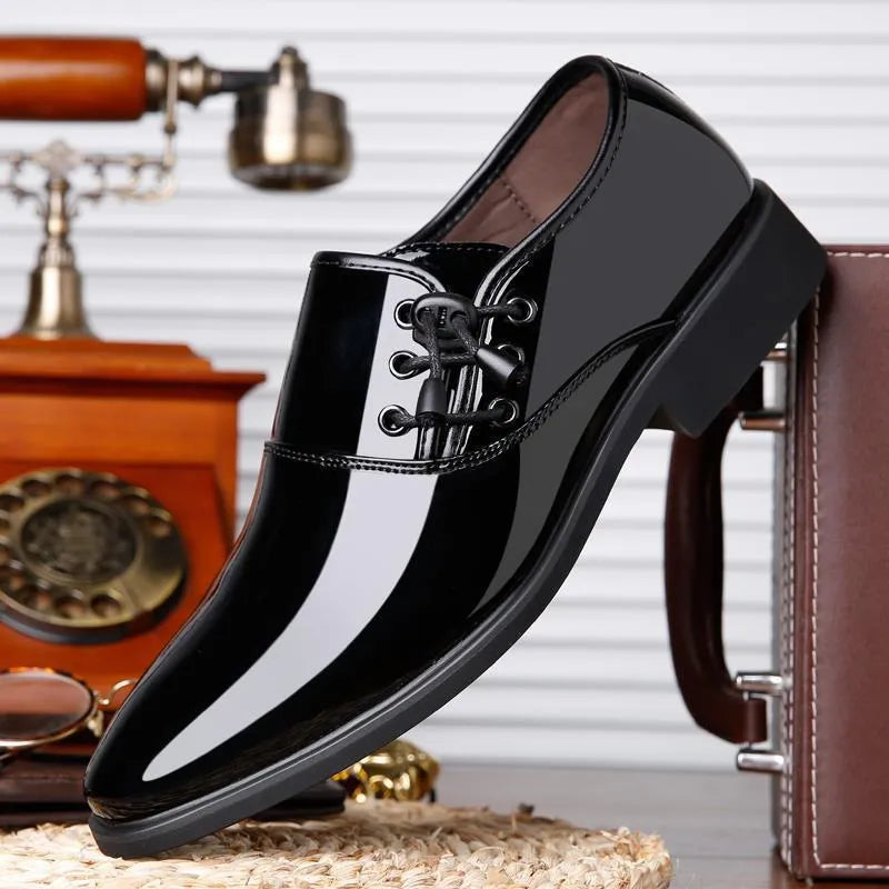 Men's black and brown formal business shoes with round toe and square heel on a rubber sole.