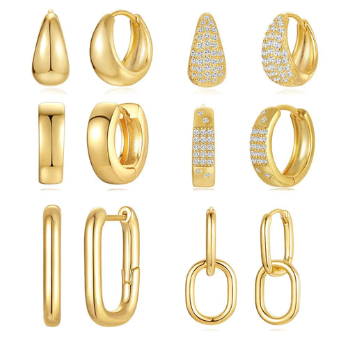 Golden brass earclip earrings with geometric round drop design on white background