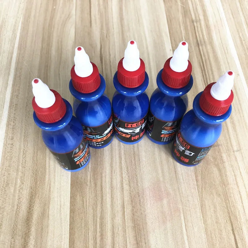 Small blue car scratch repair wiping tool kit with applicator pad and repair agent bottle