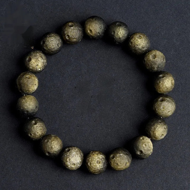Obsidian crater ball bracelet with textured beads in silver stone or golden meteorite finish
