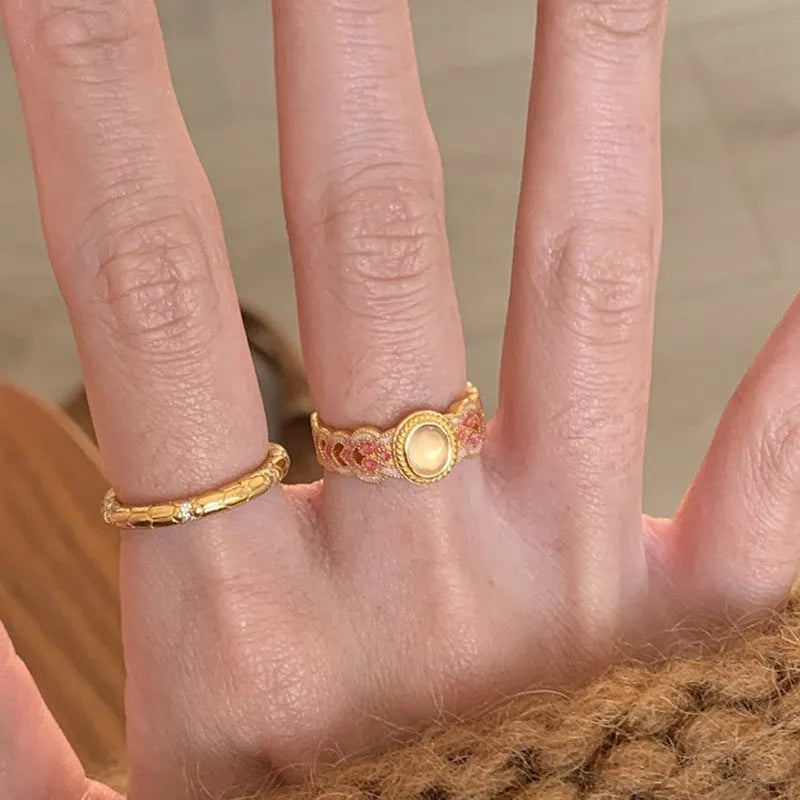 Geometric pink crystal enamel open ring with gold plating showing adjustable design