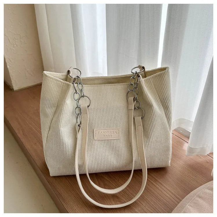 Corduroy one-shoulder tote handbag in street style with three-dimensional pocket