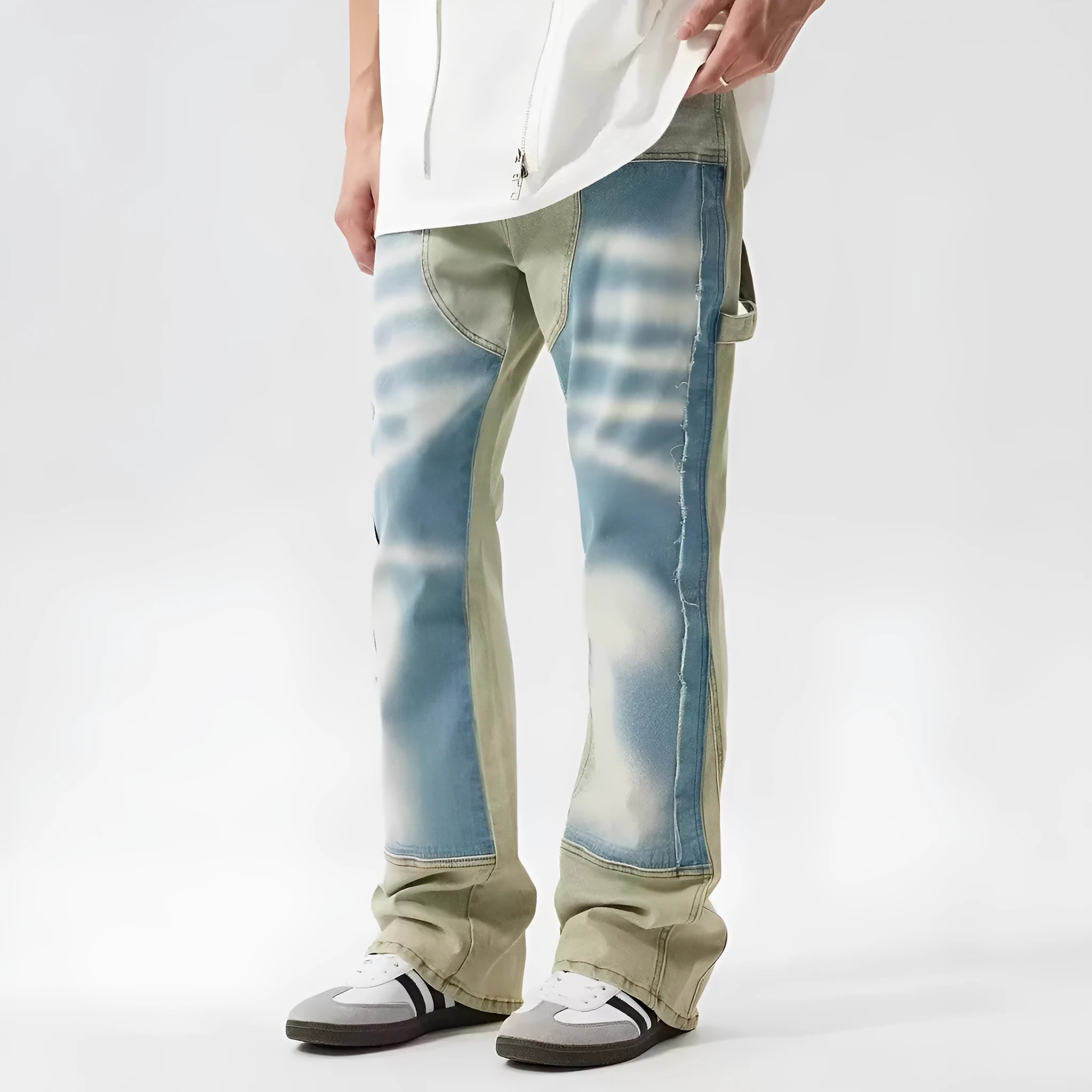 Men's yellow and blue patchwork distressed jeans with splash-ink design detail