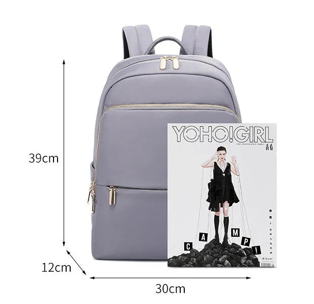 Large capacity women's Oxford cloth backpack in black and grey colours showing waterproof anti-theft design