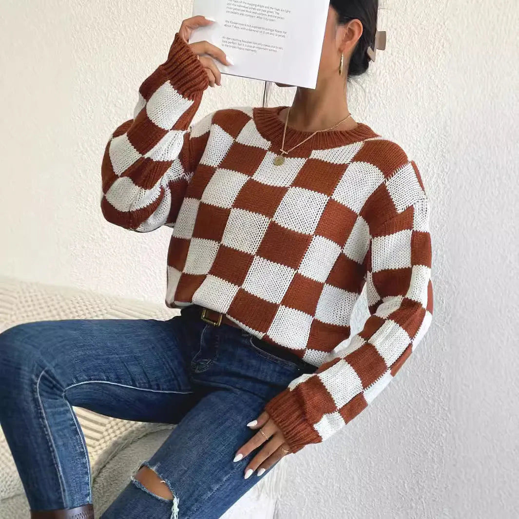 Dark brown plaid acrylic pullover sweater with round neck and long sleeves on hanger