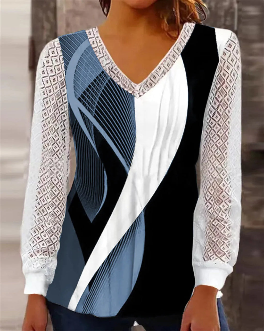 Women's purple V-neck loose top with long sleeves and a hollow-out lace print pattern.