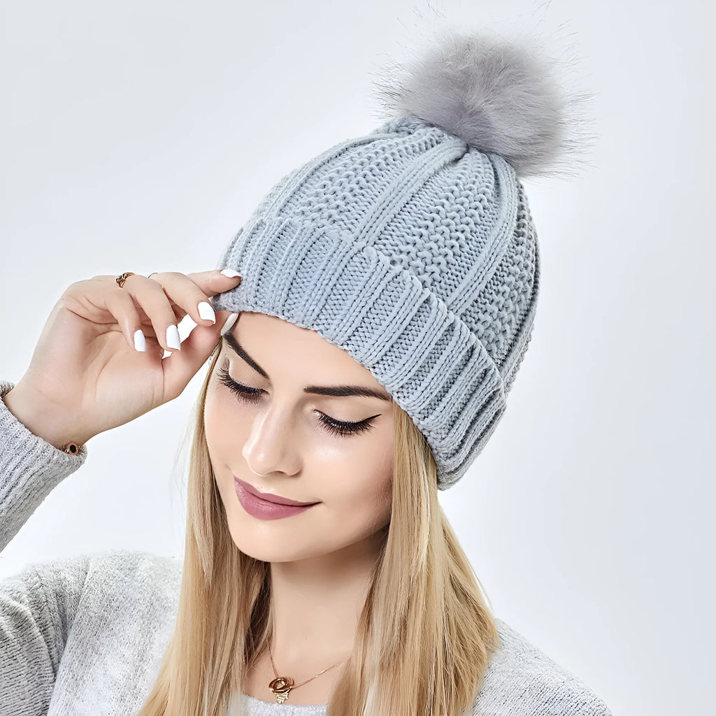 Women's wool beanie hat with satin lining and faux fur pom pom in multiple colours