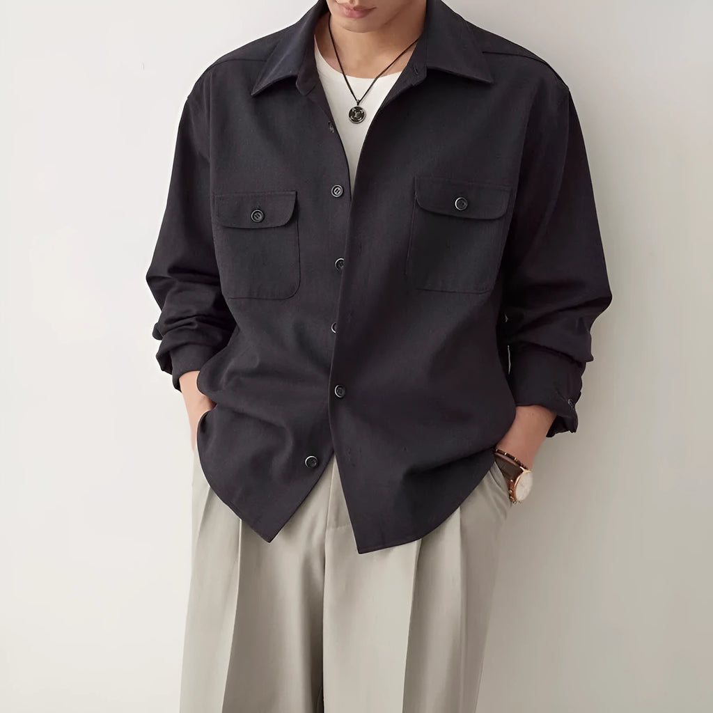 Men's simple lapel long sleeve shirt in light sand rice colour, cotton blend fabric, laid flat.