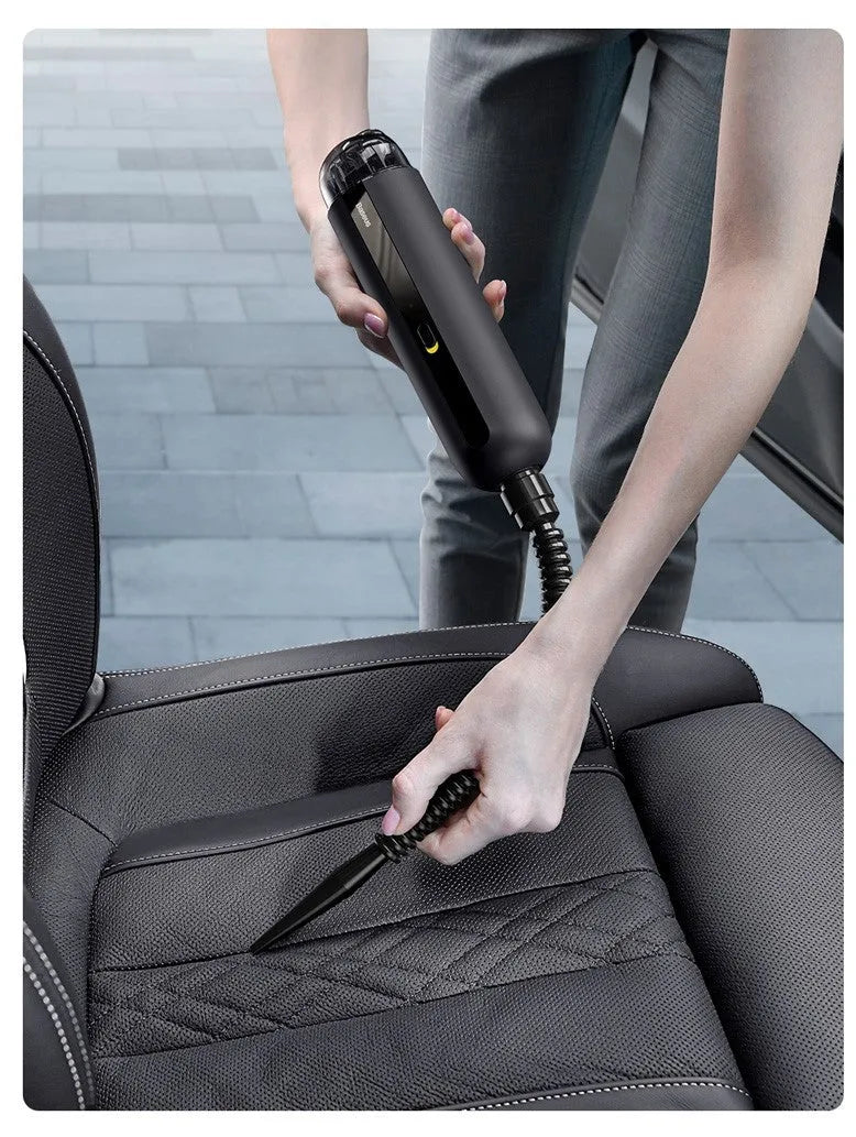 Baseus handheld car vacuum cleaner in black, white, or green, shown with blowing hose attachment.