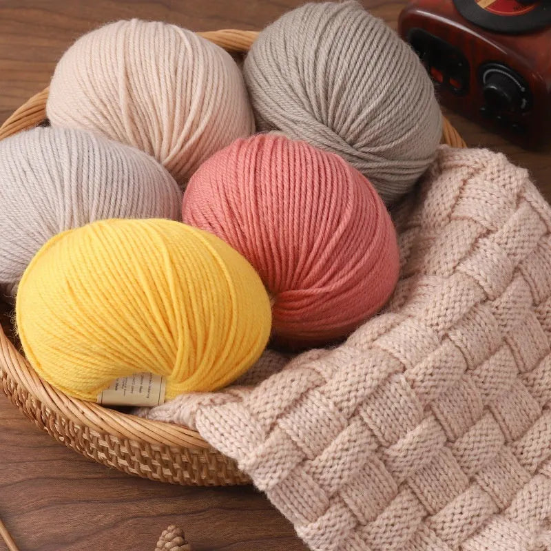 Hand-knitting wool thread in multiple colours for baby garments on size 10 needles