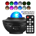 Black parallel style starry sky projection lamp with water ripple laser effects on a desktop.