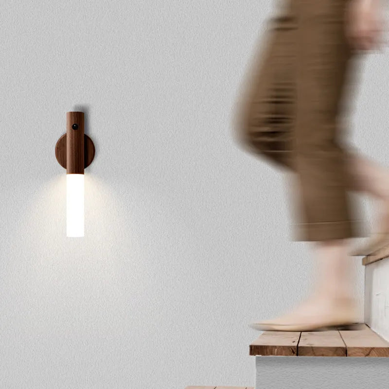 Smart sensor LED desk lamp with solid wood base and clear acrylic shade on a wooden table.