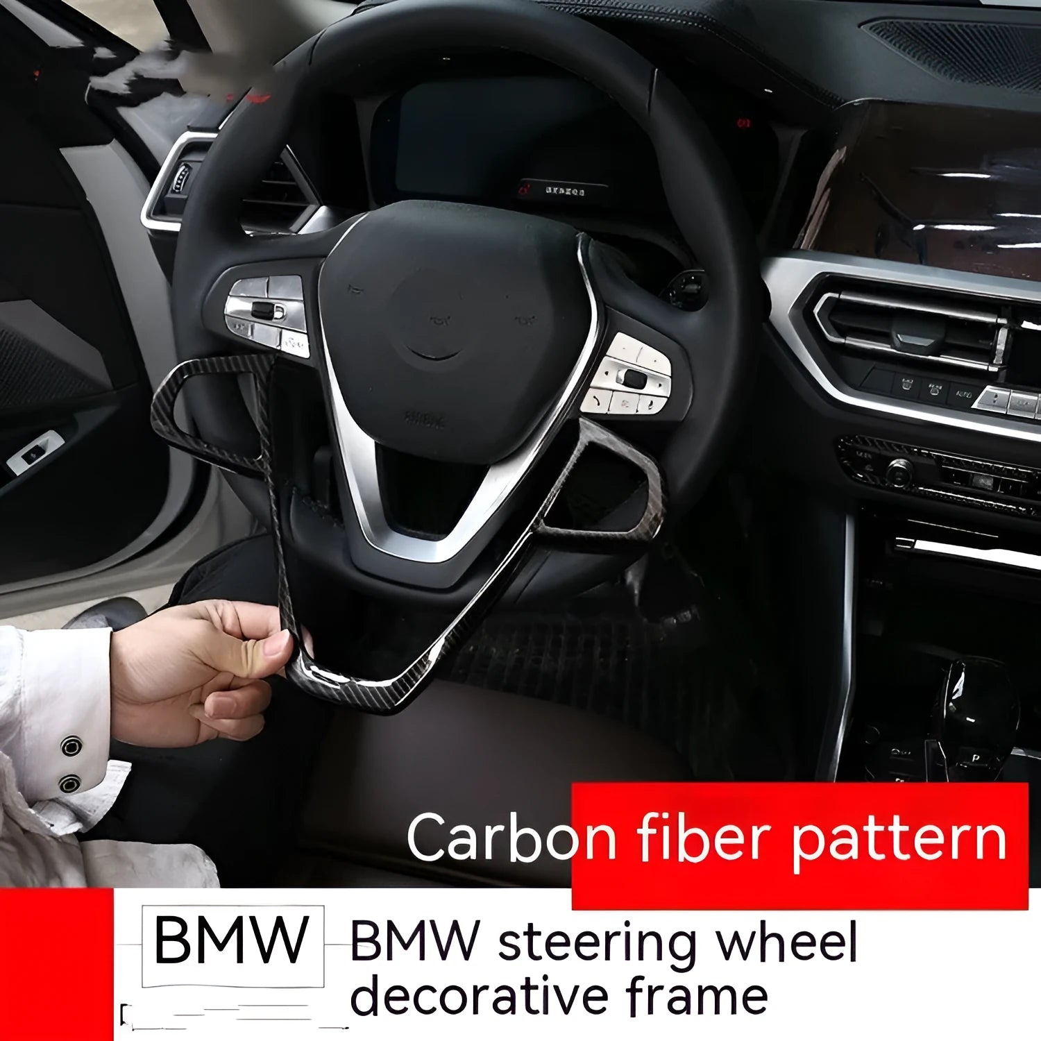 Black carbon fibre pattern button frame decoration for a BMW steering wheel.