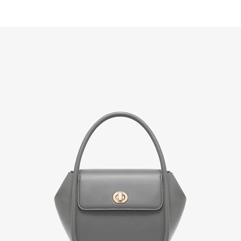 Women's leather wing-shaped tote bag with hard handle and cross-body strap in four colour options