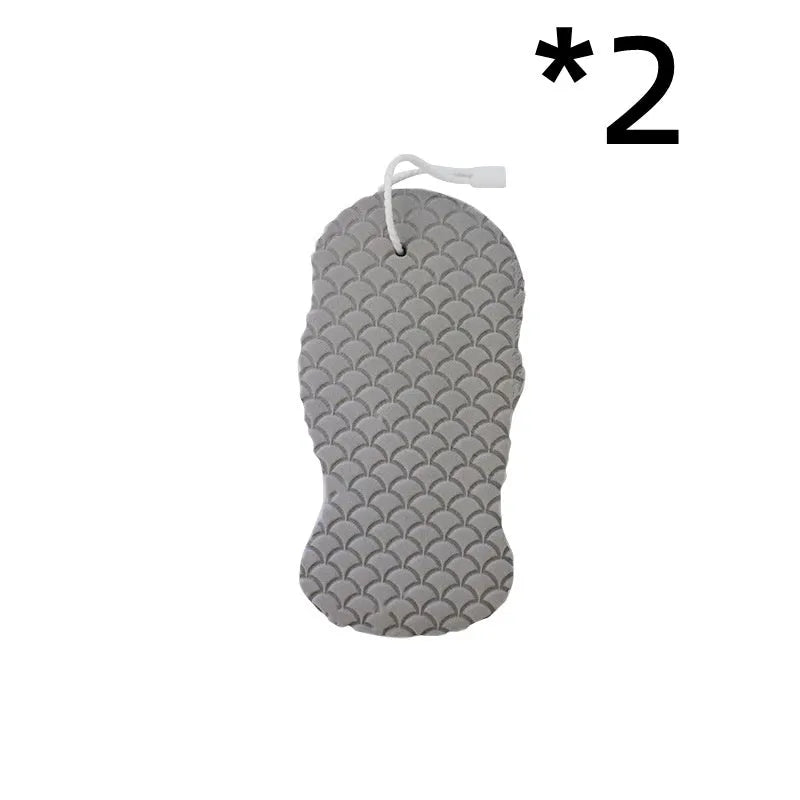 White 3D fish scale pattern bath sponge ball on a bathroom surface