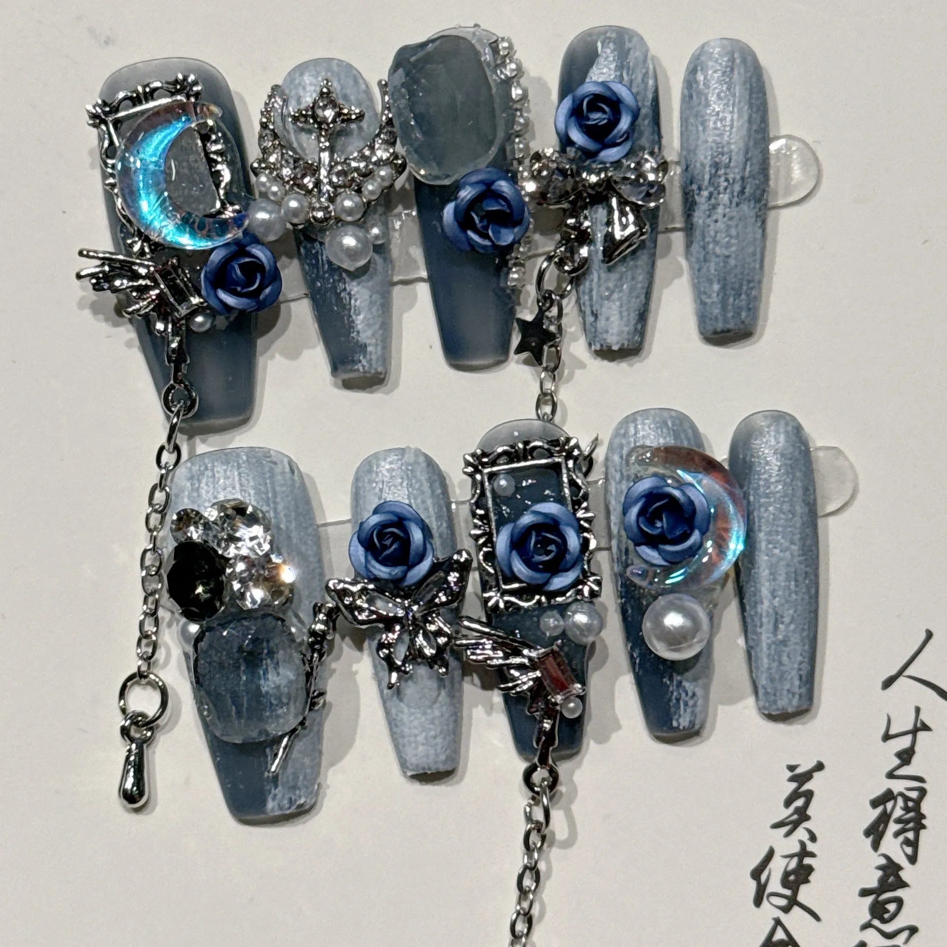 Heavy industry night blue press-on nails with ornate rose and tulip patterns in four sizes XS to L