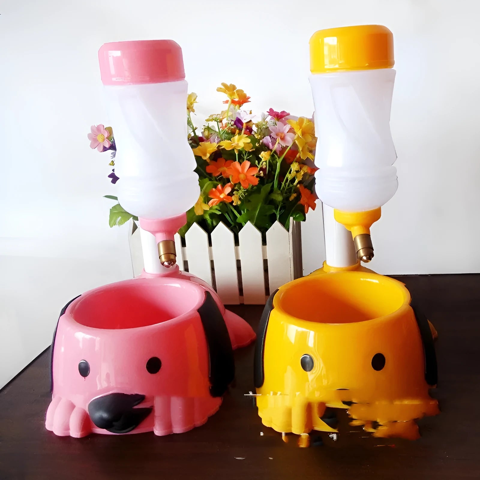 Pink adjustable height pet drinking bowl on a rod-lifting stand