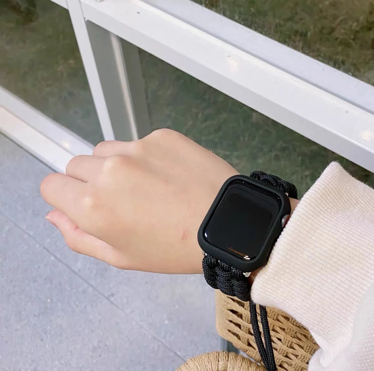Paracord braided smart watch strap in black colour showing braided texture and standard watch attachment