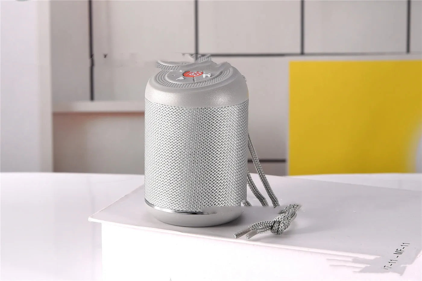 Portable outdoor Bluetooth subwoofer speaker shown in available colours: black, blue, camouflage, light blue, red, or silver.