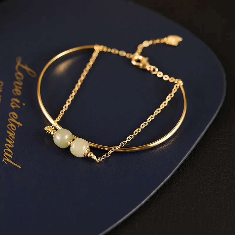 Women's Hetian jade lucky beads bracelet with gold inlay in single, double, and three-bead versions.