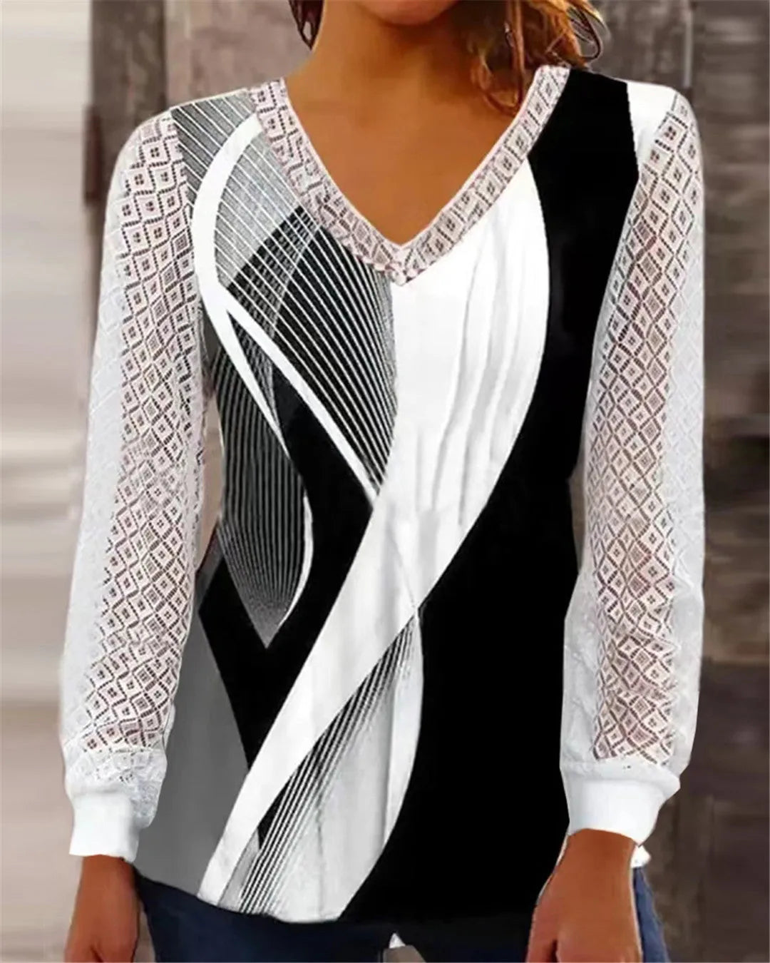 Women's purple V-neck loose top with long sleeves and a hollow-out lace print pattern.