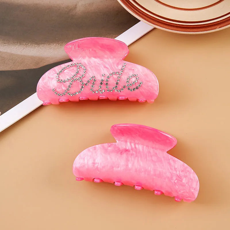 Pink and white 10cm acrylic shark hair clips with multi-diamond spot drill pattern and double-sided design