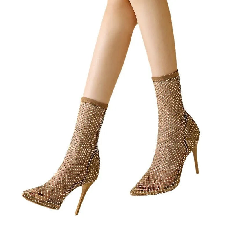 Gold mesh pointed toe stiletto high heel sandals on a white background