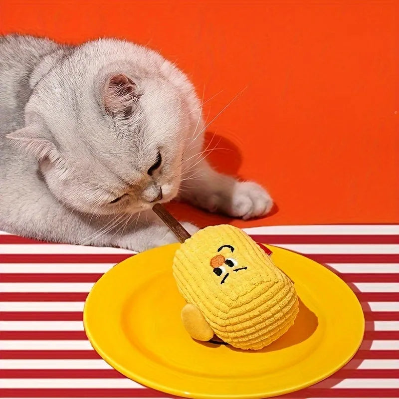 A corn cob shaped chew toy for cats made from polished beech wood, shown next to a tape measure indicating its 15cm length.