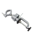 Small clamp-on bench vise with a 360-degree rotating tungsten steel head on a workbench edge.