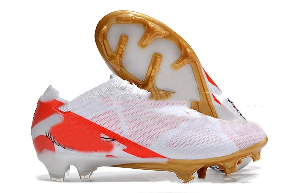 Men's low-top knitted football shoes with white/blue colourway, showing FG studs on rubber outsole and lace-up front.