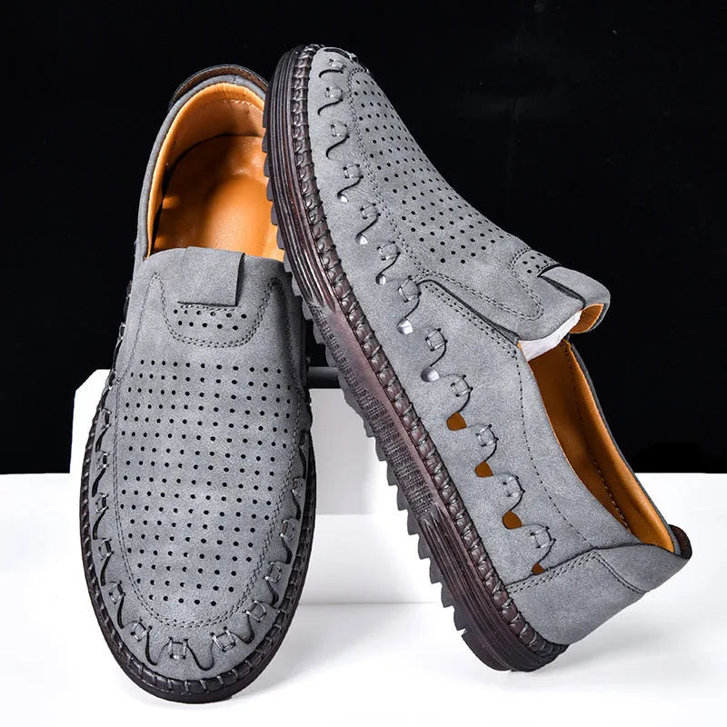 Men's brown slip-on casual shoes with artificial PU upper and visible sewing construction around PVC sole