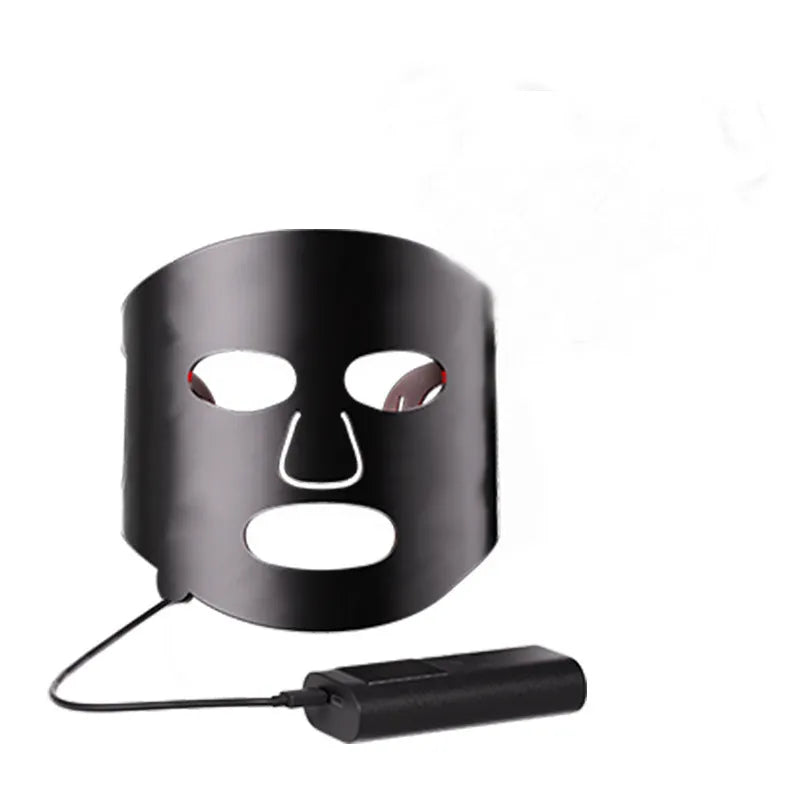 Black and white LED phototherapy face mask with controller for home skin light therapy.
