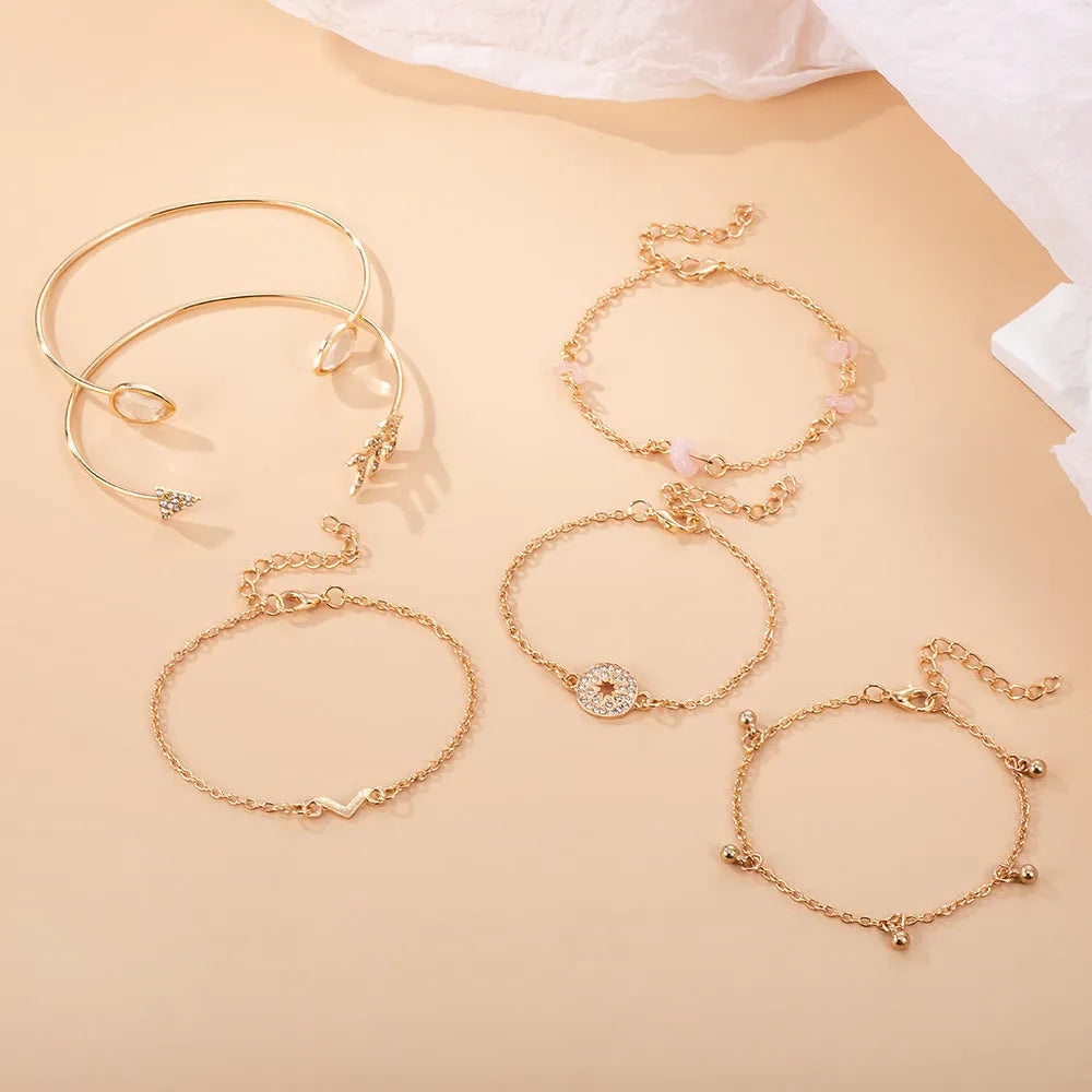 Golden spot drill charm bracelet set with arrow and water drop shapes