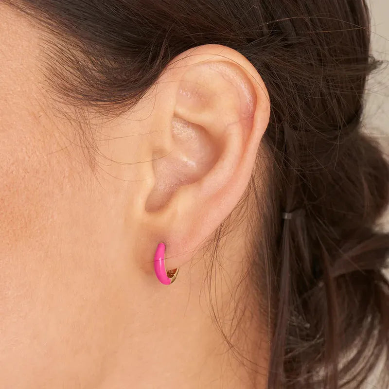 Geometric U-shaped silver wire drop earrings with glossy oval epoxy resin elements in various colours.