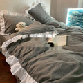 Mori style solid colour linen four-piece bedding set with quilt cover, sheet, and pillowcases.