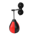 Pear-shaped black PU boxing reaction ball mounted on a wall with double suction cups for home training.