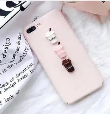 Soft silicone TPU iPhone case with a raised 3D cartoon cat design, shown in various colours.