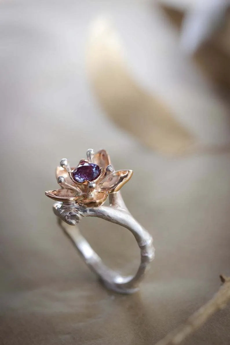 Silver two-tone alloy ring with floral and geometric design for women, showing UK size options.