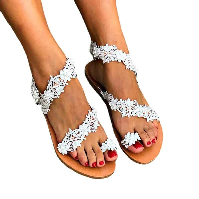 White women's flat sandals with rhinestone floral decoration and round toe slip-on design