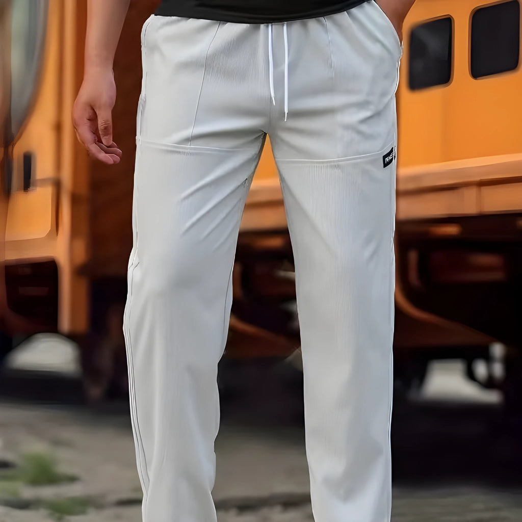 Men's polyester trousers for spring and autumn available in multiple colours and sizes