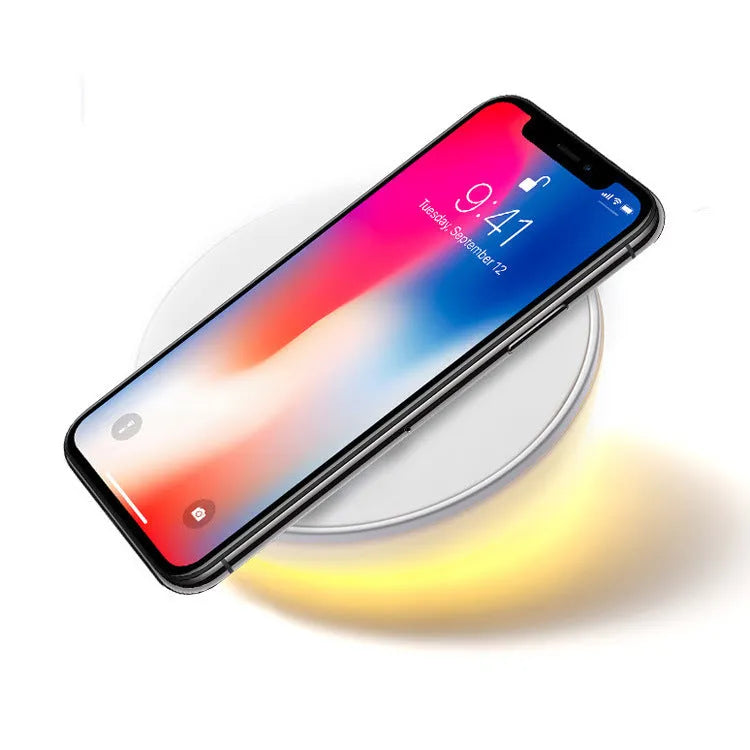 White wireless charger with digital clock display and three control buttons for mobile phones