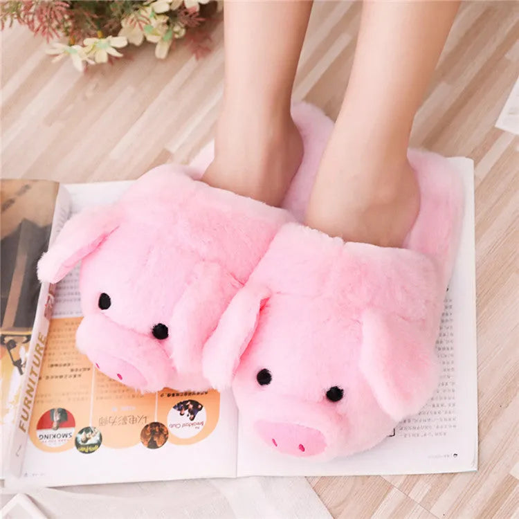 Pink plush pig slippers for adults with soft short fur and PP cotton filling on a white background.
