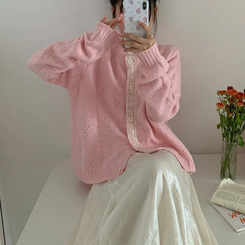 Loose apricot-coloured Korean-style cardigan sweater coat with regular sleeves on a hanger.