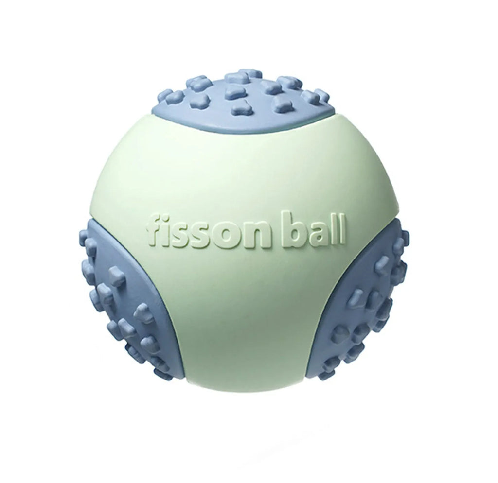 Green rolling ball dog toy on wooden floor showing 64mm diameter