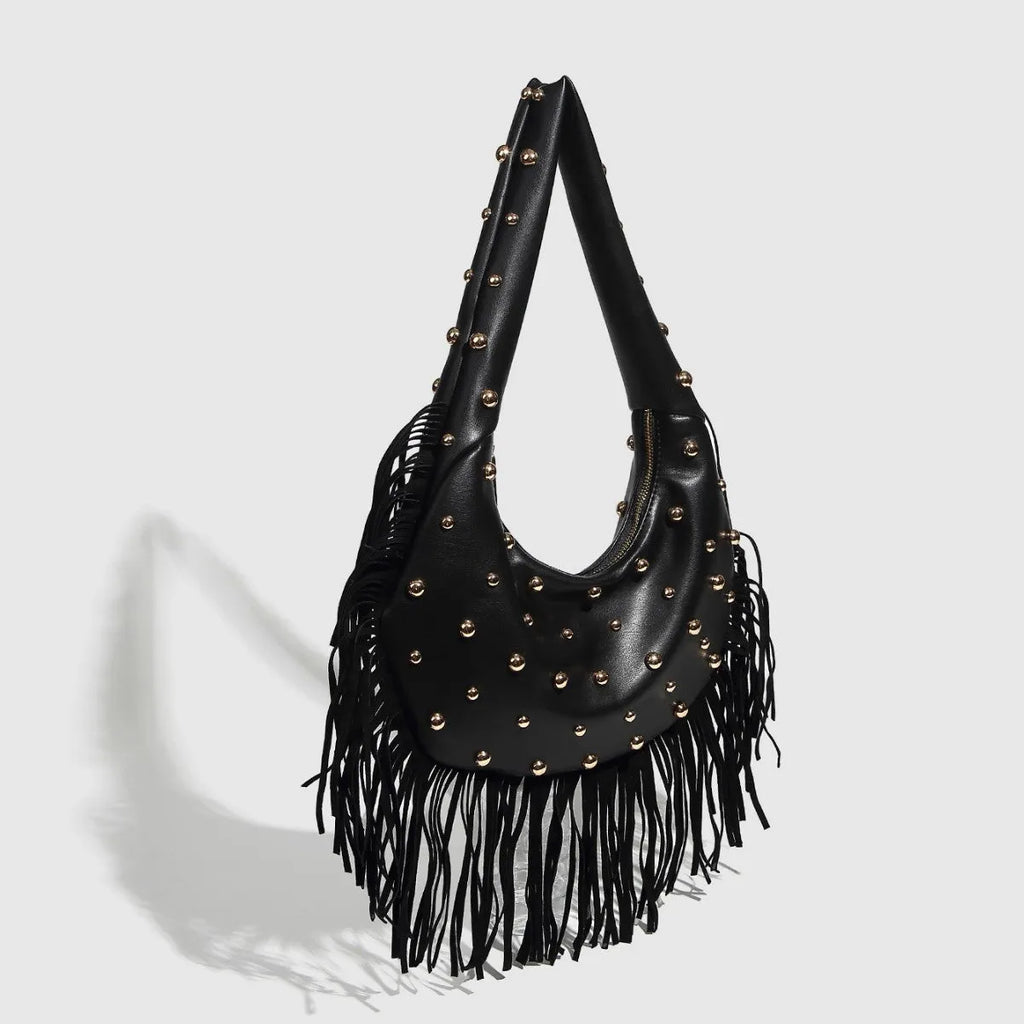 Retro black shoulder handbag with tassel detail showing internal phone compartment