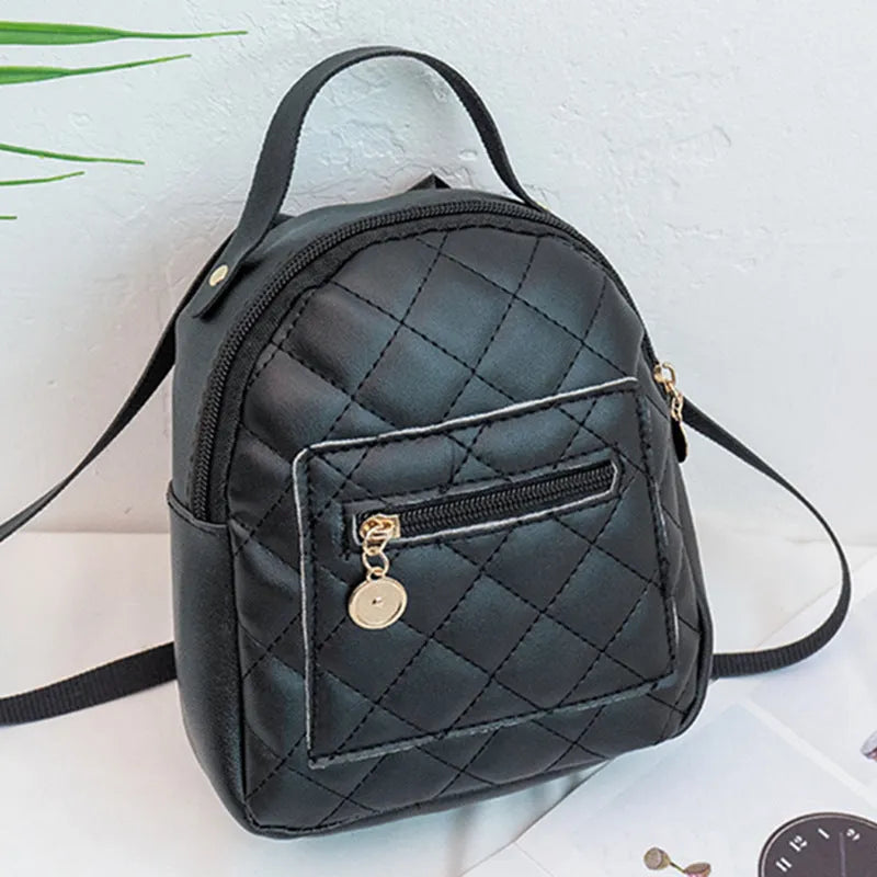 Girls' hard shell backpack with embroidery in black, pink, or white colours showing square shape and sandwich pocket