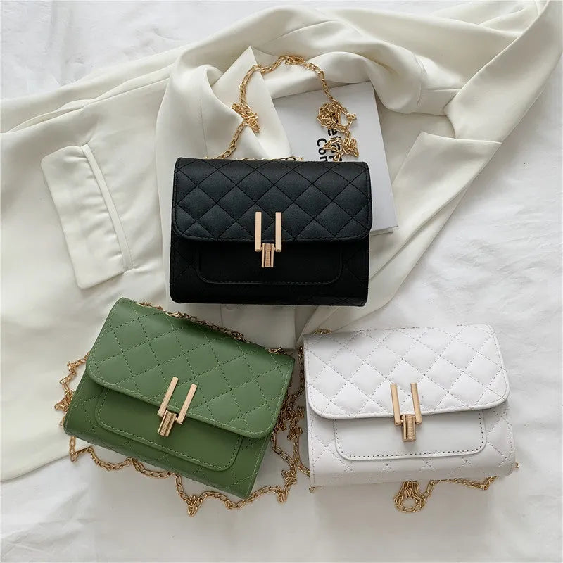 Women's crossbody bag with diamond lattice chain detailing and adjustable shoulder strap