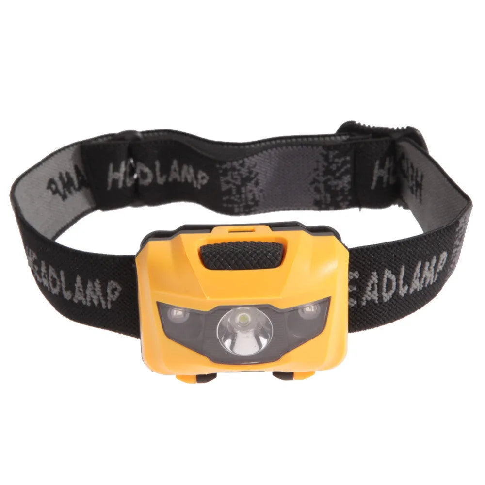 Black head torch with white and red LEDs mounted on adjustable headband for outdoor use
