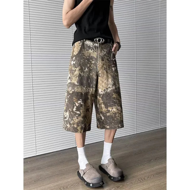 Yellow snake pattern camouflage cropped jeans on hanger showing tooling detail